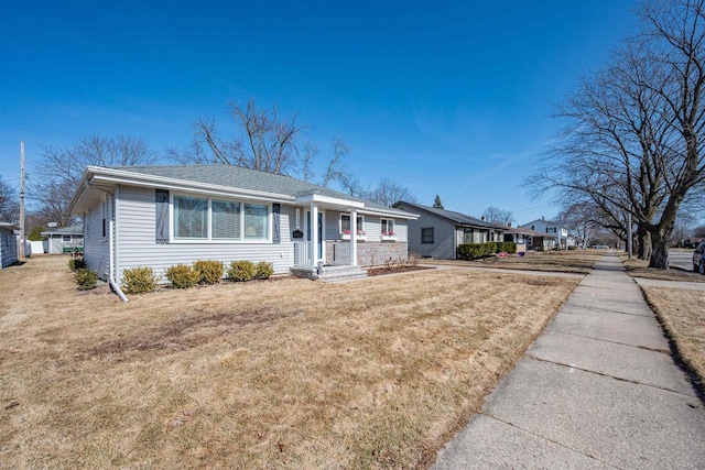 ranch-style house with a front lawn