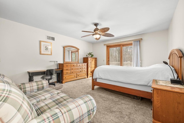 bedroom featuring access to exterior, visible vents, a ceiling fan, and carpet floors