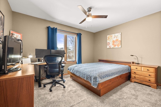 bedroom featuring ceiling fan and light carpet