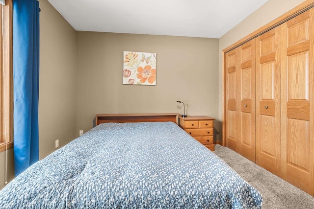 carpeted bedroom featuring a closet