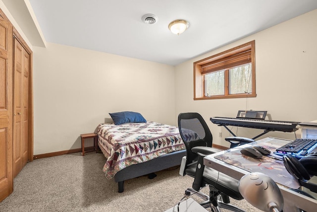 bedroom with carpet, baseboards, visible vents, and a closet