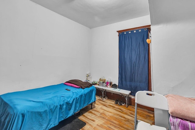 bedroom with wood finished floors