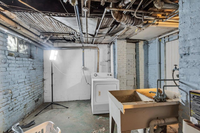 basement with washer / dryer and a sink