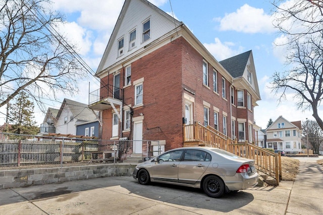 view of property with a residential view and fence