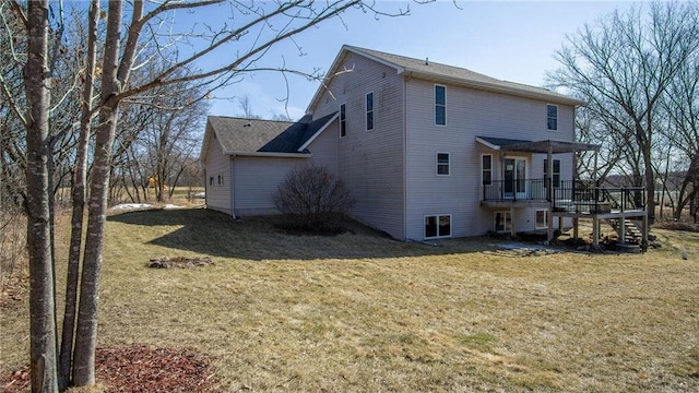 back of house with a deck, stairs, and a lawn