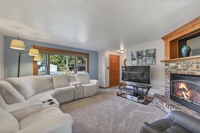 living area with a fireplace, baseboards, and carpet floors