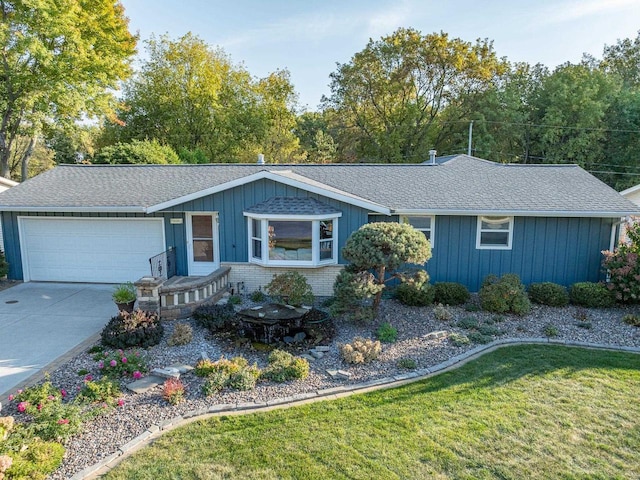 ranch-style house with driveway, brick siding, an attached garage, and a shingled roof