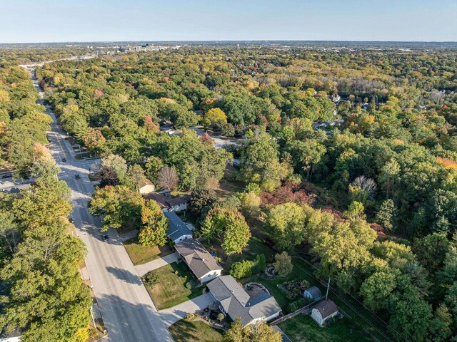 drone / aerial view featuring a view of trees