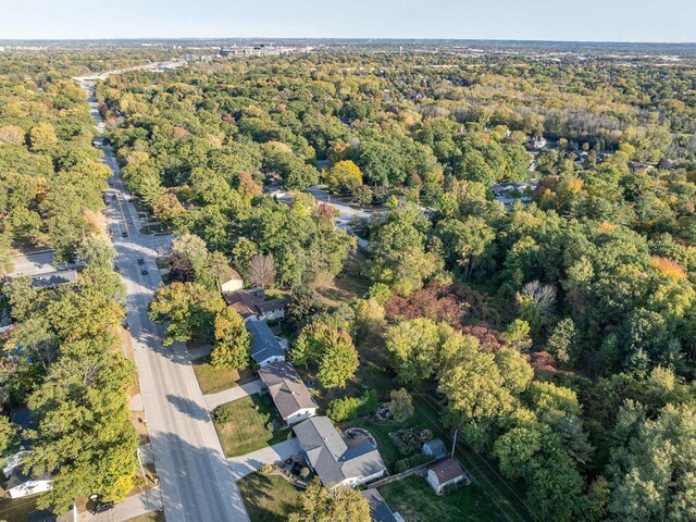 drone / aerial view featuring a forest view