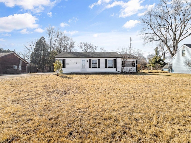 ranch-style house featuring a front lawn