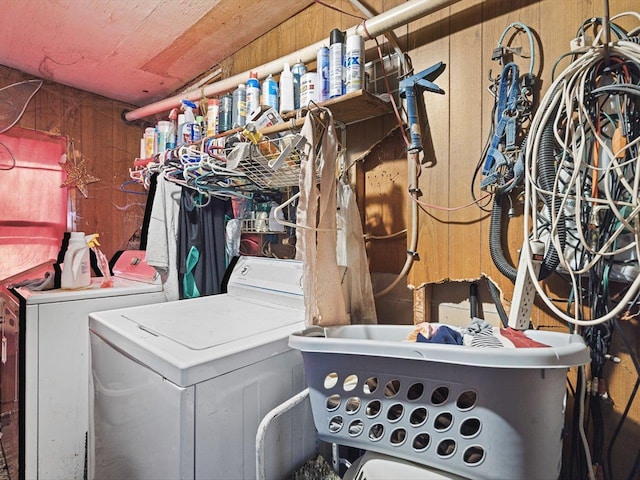 laundry room featuring washing machine and clothes dryer and laundry area