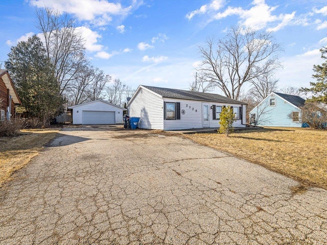 view of front of property featuring an outbuilding and a garage