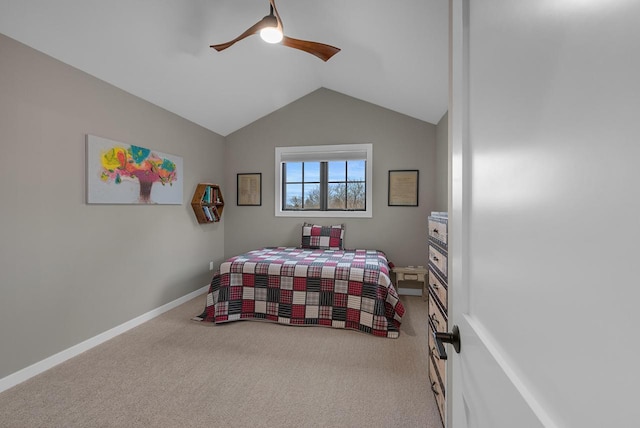 carpeted bedroom with baseboards, lofted ceiling, and a ceiling fan