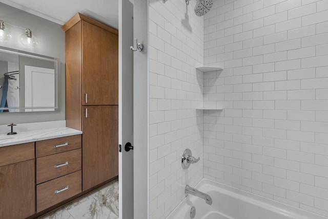 full bath with marble finish floor, washtub / shower combination, and vanity