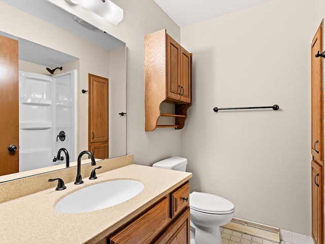 full bath with a shower, vanity, toilet, and a baseboard heating unit