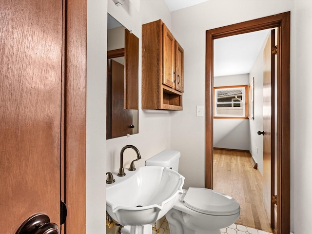 bathroom featuring a sink and toilet