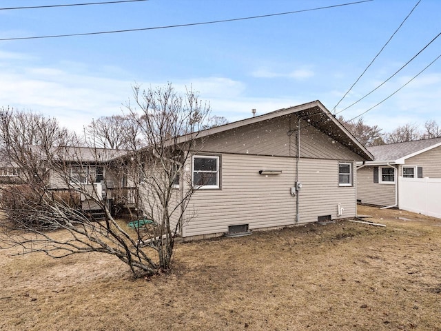 view of property exterior with fence