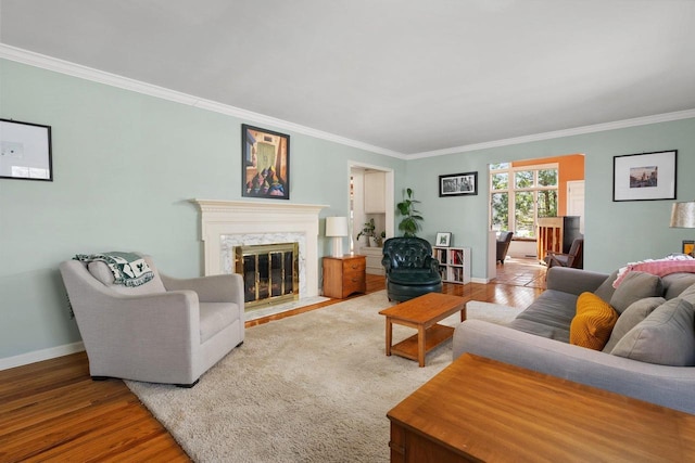1914 Eastwood Ave, Janesville, WI 53545 - living area with a high end fireplace, crown molding, baseboards, and wood finished floors