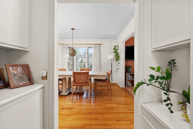1914 Eastwood Ave, Janesville, WI 53545 - dining area featuring crown molding and light wood-style floors