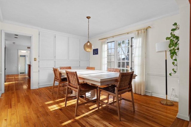 1914 Eastwood Ave, Janesville, WI 53545 - dining room with light wood-style floors, ornamental molding, and a decorative wall
