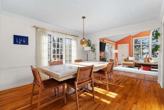 1914 Eastwood Ave, Janesville, WI 53545 - dining area featuring a healthy amount of sunlight, crown molding, and light wood-style floors