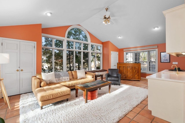 1914 Eastwood Ave, Janesville, WI 53545 - living area featuring light tile patterned floors, high vaulted ceiling, and a ceiling fan