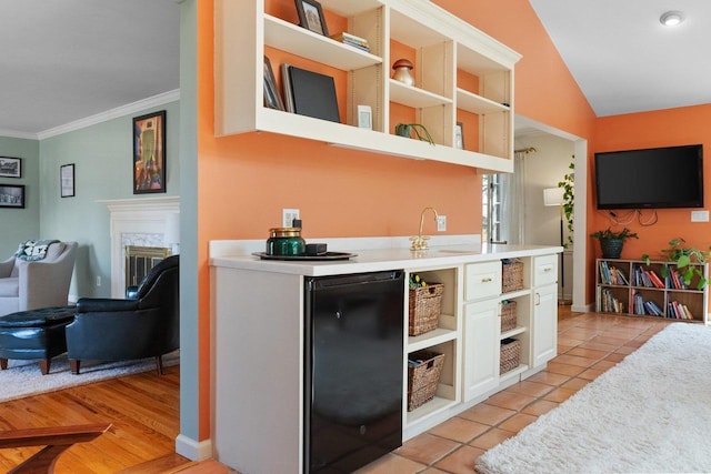 1914 Eastwood Ave, Janesville, WI 53545 - kitchen with open shelves, crown molding, light countertops, and a premium fireplace