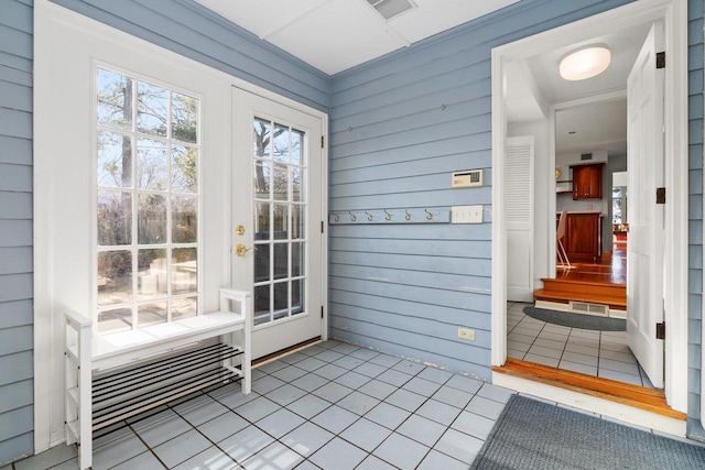 1914 Eastwood Ave, Janesville, WI 53545 - doorway featuring tile patterned floors and wooden walls