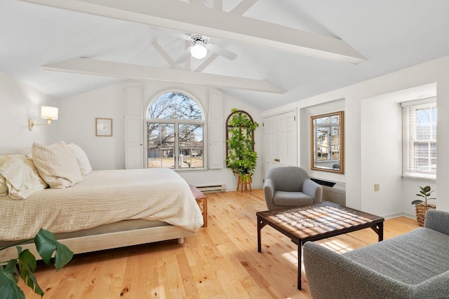 1914 Eastwood Ave, Janesville, WI 53545 - bedroom featuring vaulted ceiling with beams, light wood-type flooring, and a baseboard radiator
