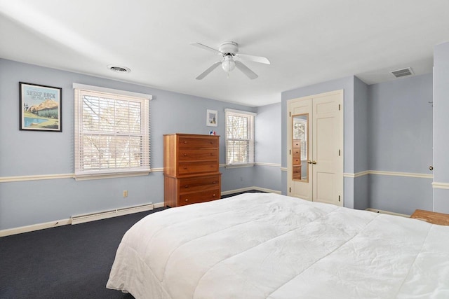 1914 Eastwood Ave, Janesville, WI 53545 - carpeted bedroom featuring visible vents, baseboards, baseboard heating, and a ceiling fan