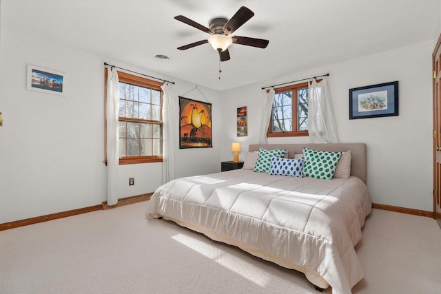 1914 Eastwood Ave, Janesville, WI 53545 - bedroom with baseboards, multiple windows, and carpet