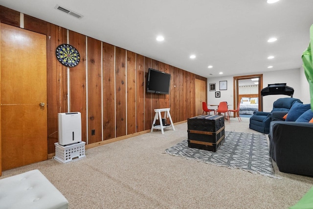 1914 Eastwood Ave, Janesville, WI 53545 - living area featuring recessed lighting, carpet, visible vents, and wood walls