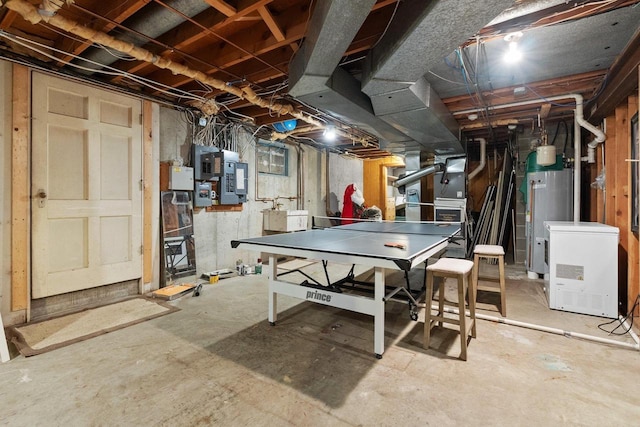 1914 Eastwood Ave, Janesville, WI 53545 - playroom featuring electric panel, unfinished concrete floors, and water heater