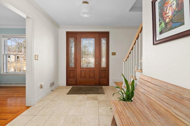 1914 Eastwood Ave, Janesville, WI 53545 - entryway featuring stairway, baseboards, visible vents, a baseboard radiator, and crown molding