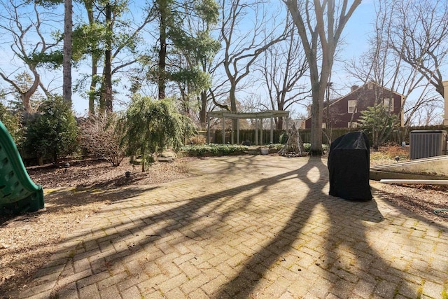 1914 Eastwood Ave, Janesville, WI 53545 - exterior space featuring central air condition unit, fence, and a patio area