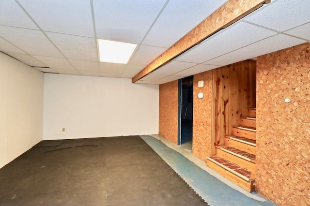 finished basement with a paneled ceiling