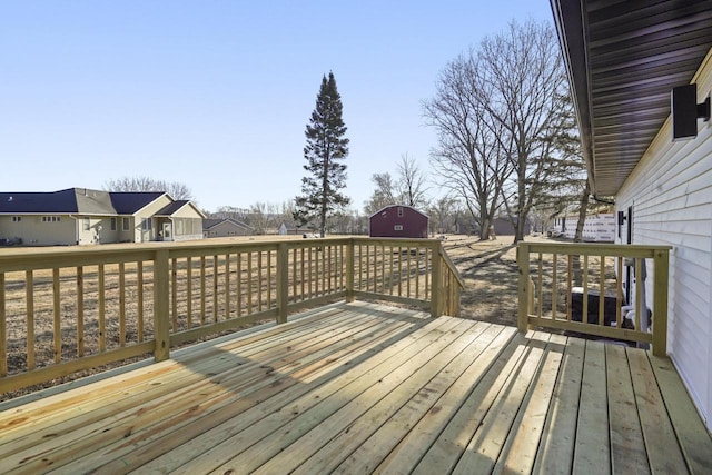 wooden deck featuring an outbuilding