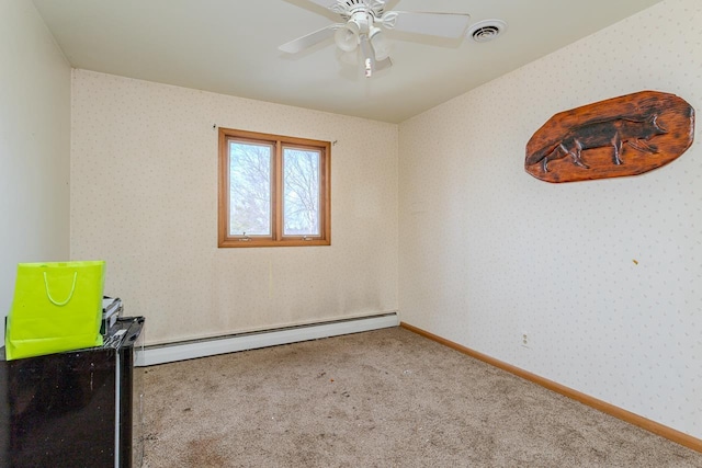 carpeted empty room featuring wallpapered walls, baseboards, visible vents, and a baseboard heating unit