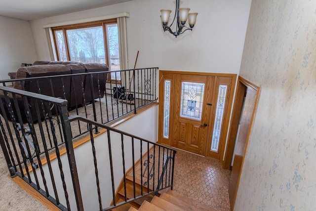 entrance foyer featuring a notable chandelier