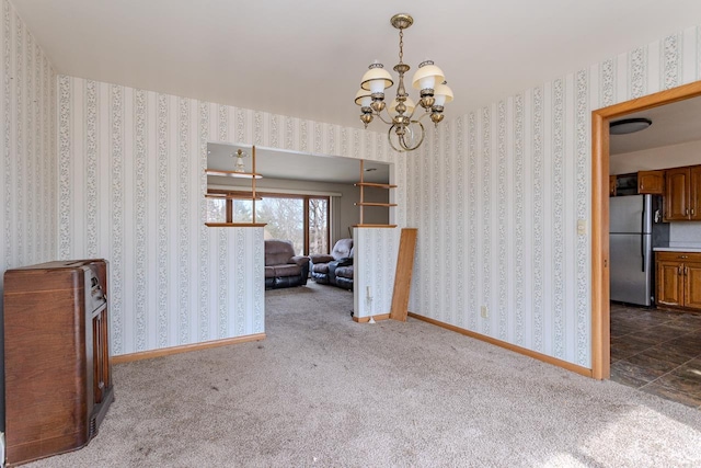 interior space with wallpapered walls, a notable chandelier, and baseboards