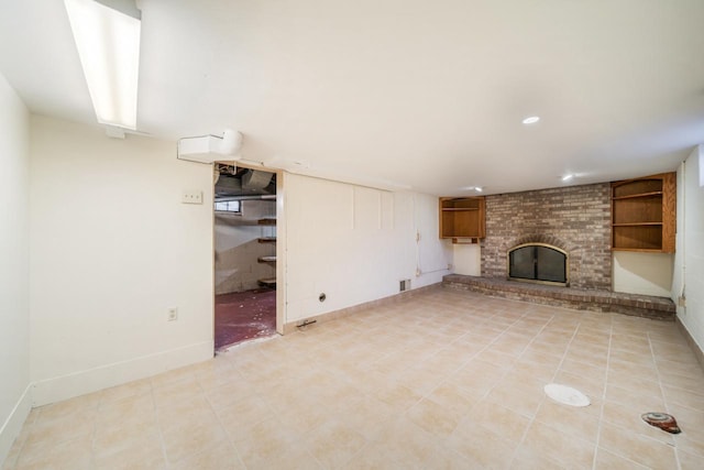 unfurnished living room with light tile patterned floors, recessed lighting, a fireplace, and baseboards