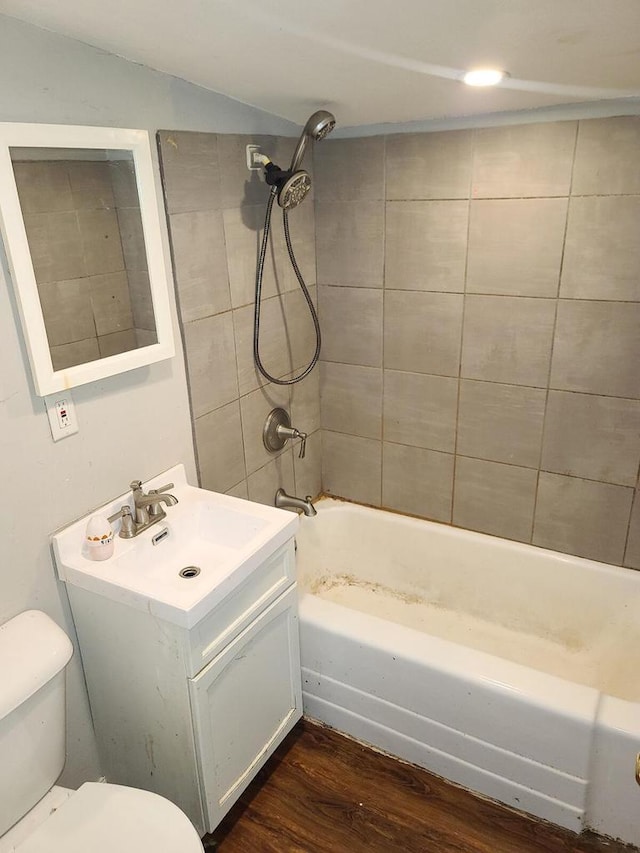 8630 W Lancaster Ave, Milwaukee, WI 53225 - bathroom featuring vanity, toilet,  shower combination, and wood finished floors