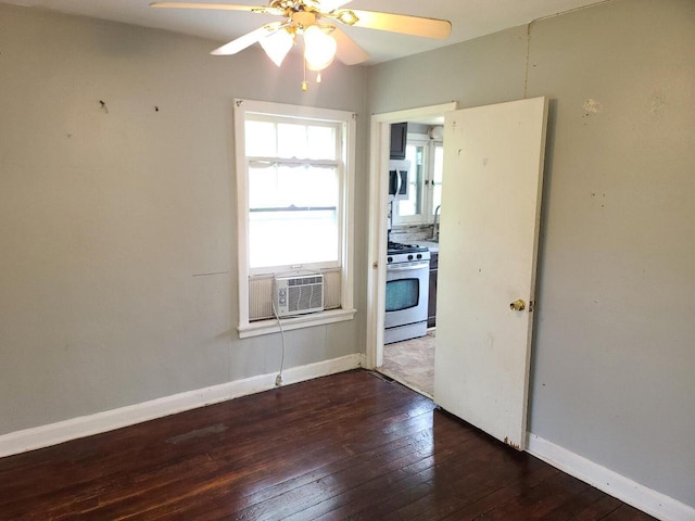 8630 W Lancaster Ave, Milwaukee, WI 53225 - unfurnished room with hardwood / wood-style floors, a ceiling fan, baseboards, and cooling unit