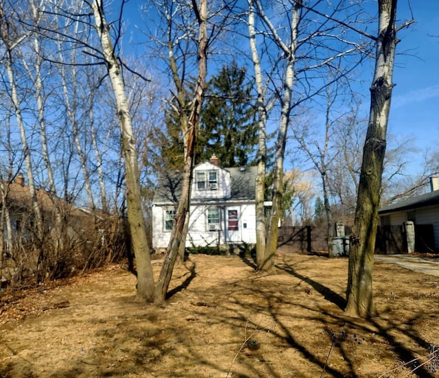 view of front facade with a chimney