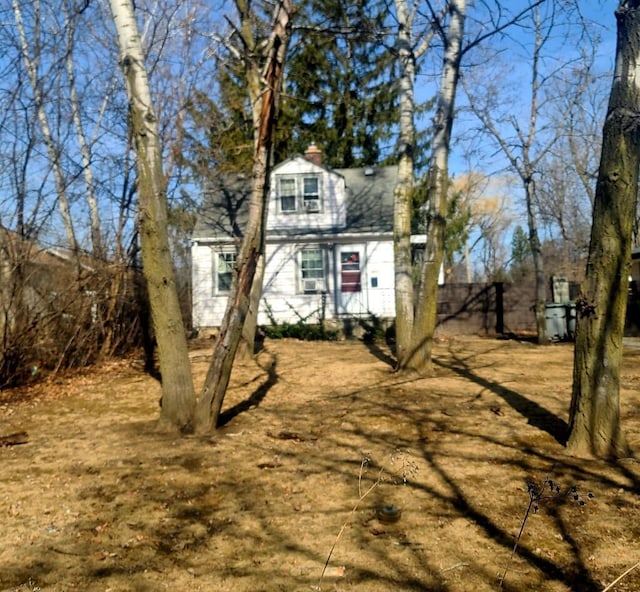 view of front facade with a chimney