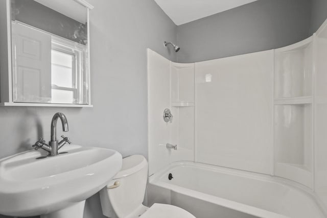 full bathroom with toilet, bathing tub / shower combination, and a sink