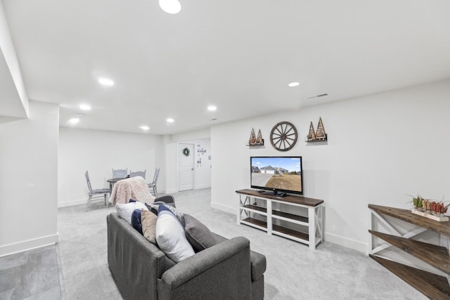 carpeted living room with visible vents, recessed lighting, and baseboards