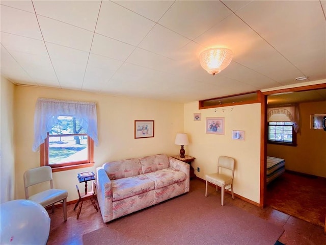 living room featuring a wealth of natural light and baseboards