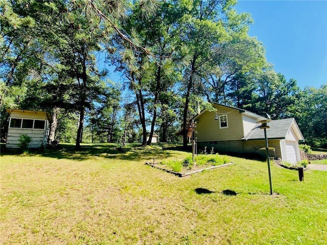 view of yard featuring a garage