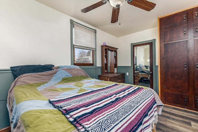 bedroom with wood finished floors and ceiling fan